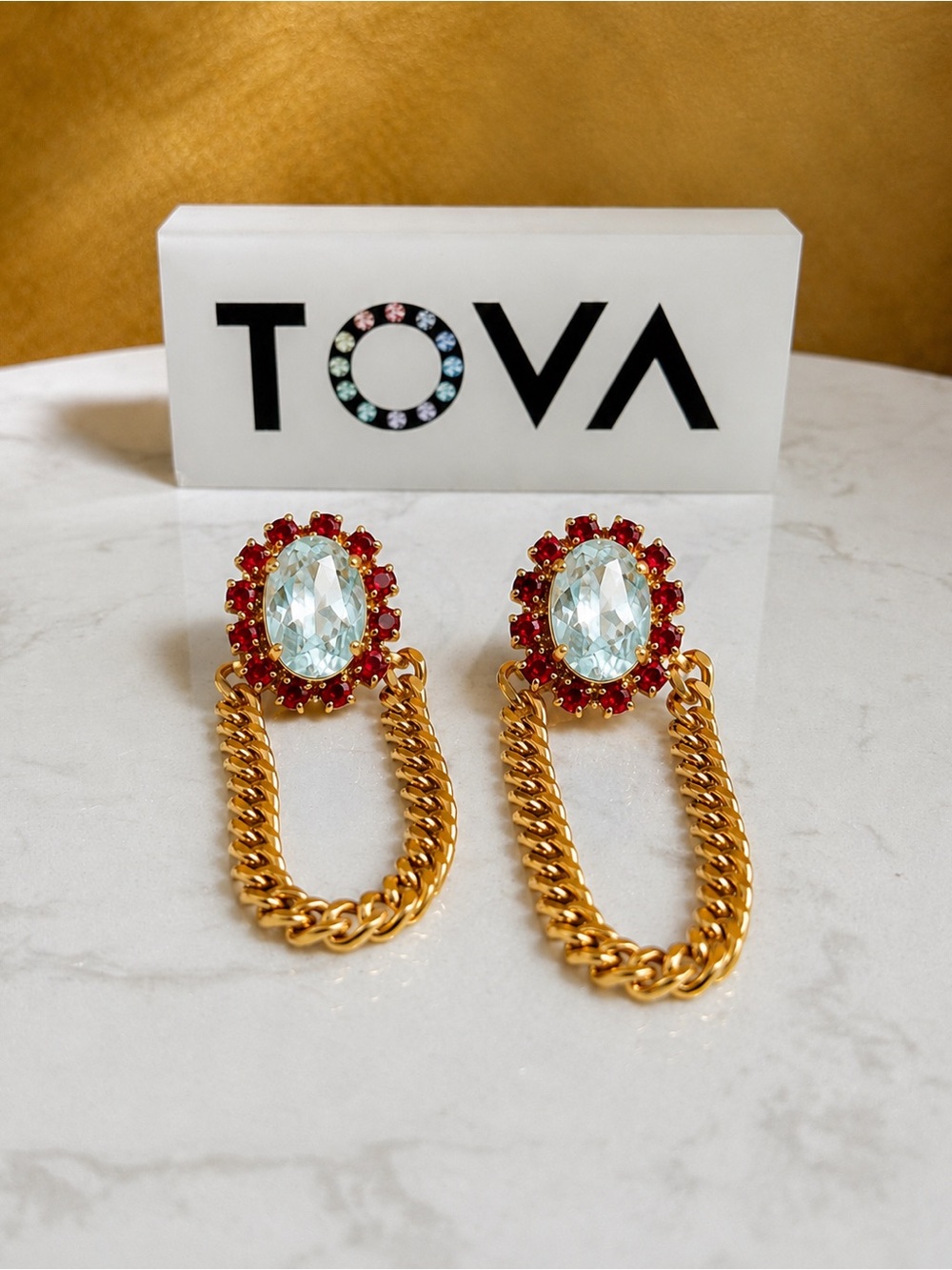 TOVA Abbey earrings in red and aqua crystals
On a gold chain drop